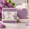 Lilac Soap with EVCo Skincare label showing purple rectangle bar and heart-shaped bar on marble dish with lilac flowers